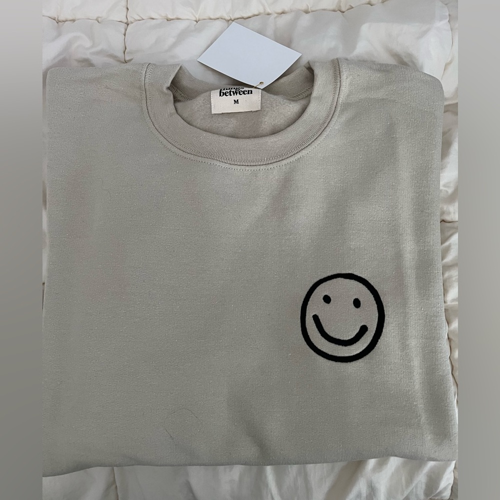 NWT Things Between Smiley Beige Crewneck Sweatshirt